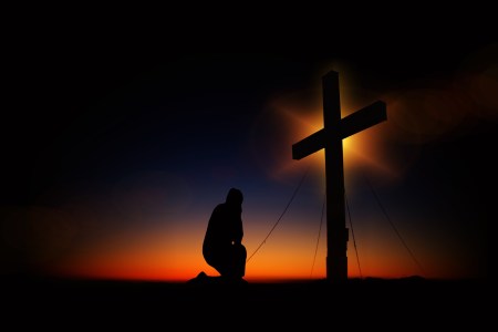 kneeling at cross